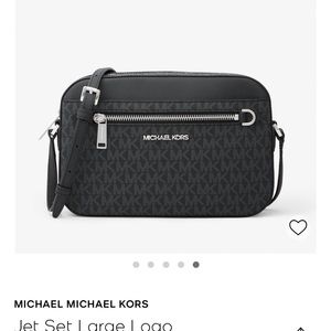 Brand new black Michael Kors hand bag still in packaging that it was deliveredin